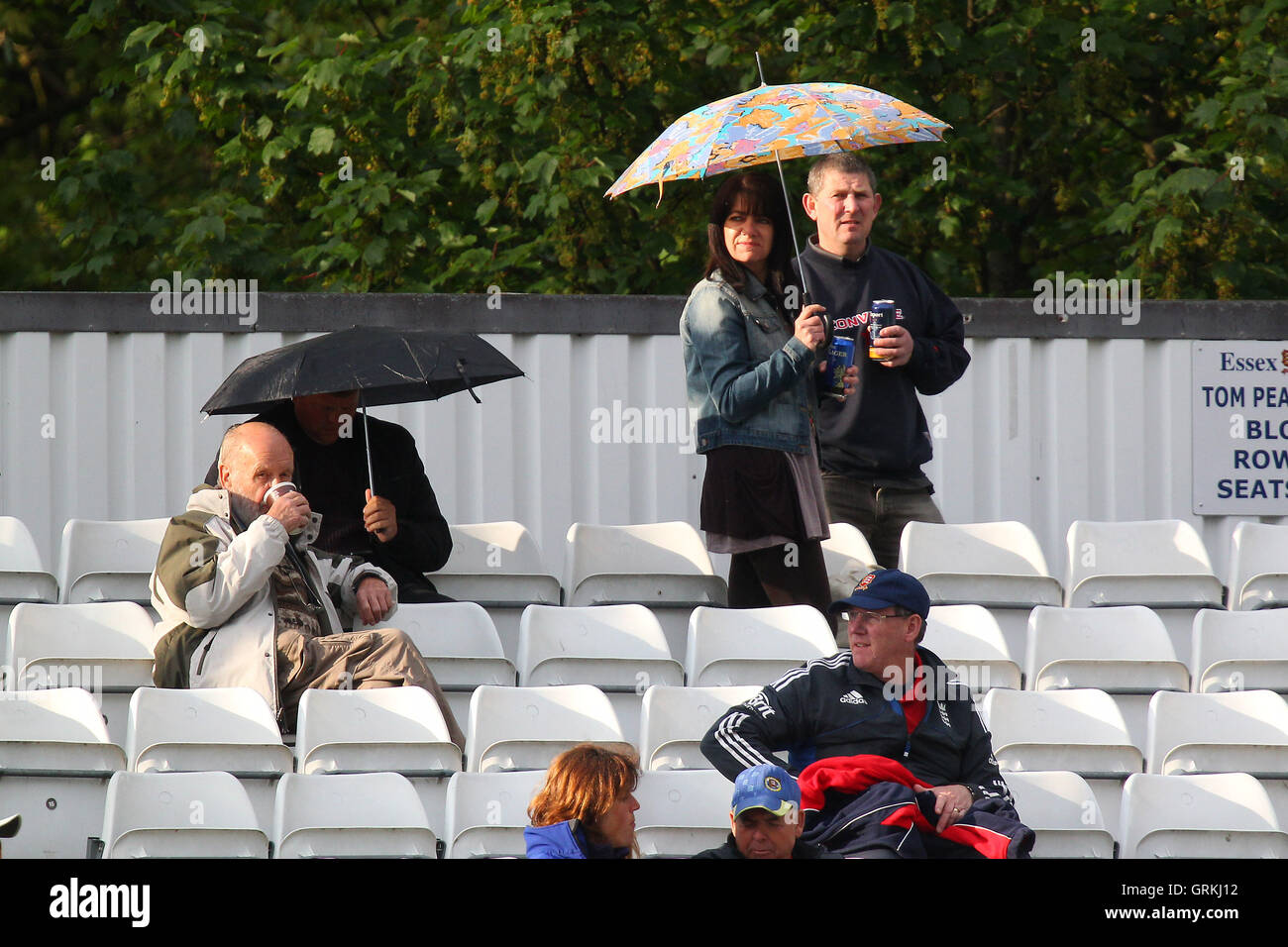 Umbrellas up around the ground as rain falls again - Essex Eagles vs Sri Lanka - 50-over Tour Match at the Essex County Ground, Chelmsford - 13/05/14 Stock Photo