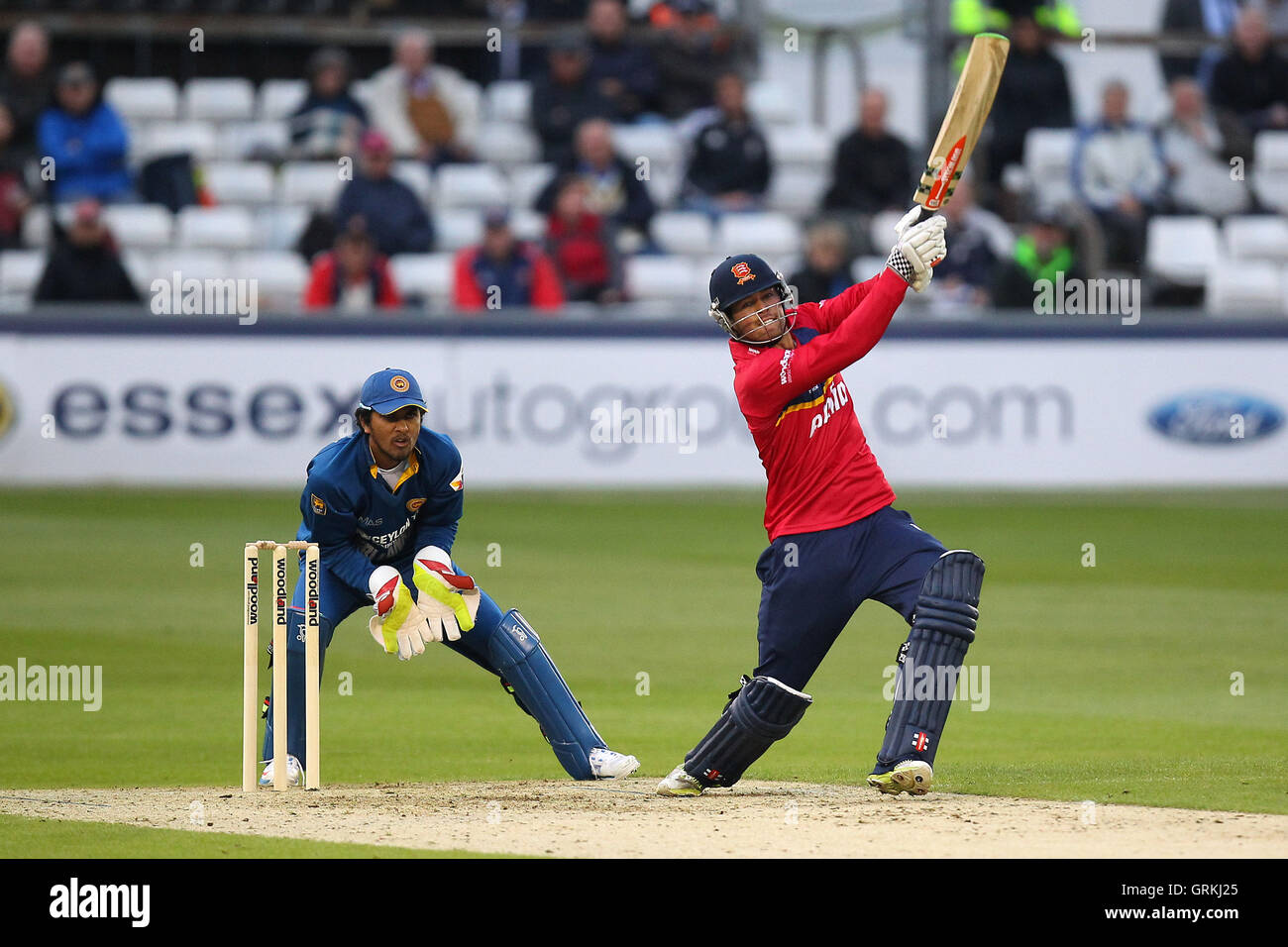 Ben Foakes of Essex hits out as Dinesh Chandimal of Sri Lanka looks on - Essex Eagles vs Sri Lanka - 50-over Tour Match at the Essex County Ground, Chelmsford - 13/05/14 Stock Photo