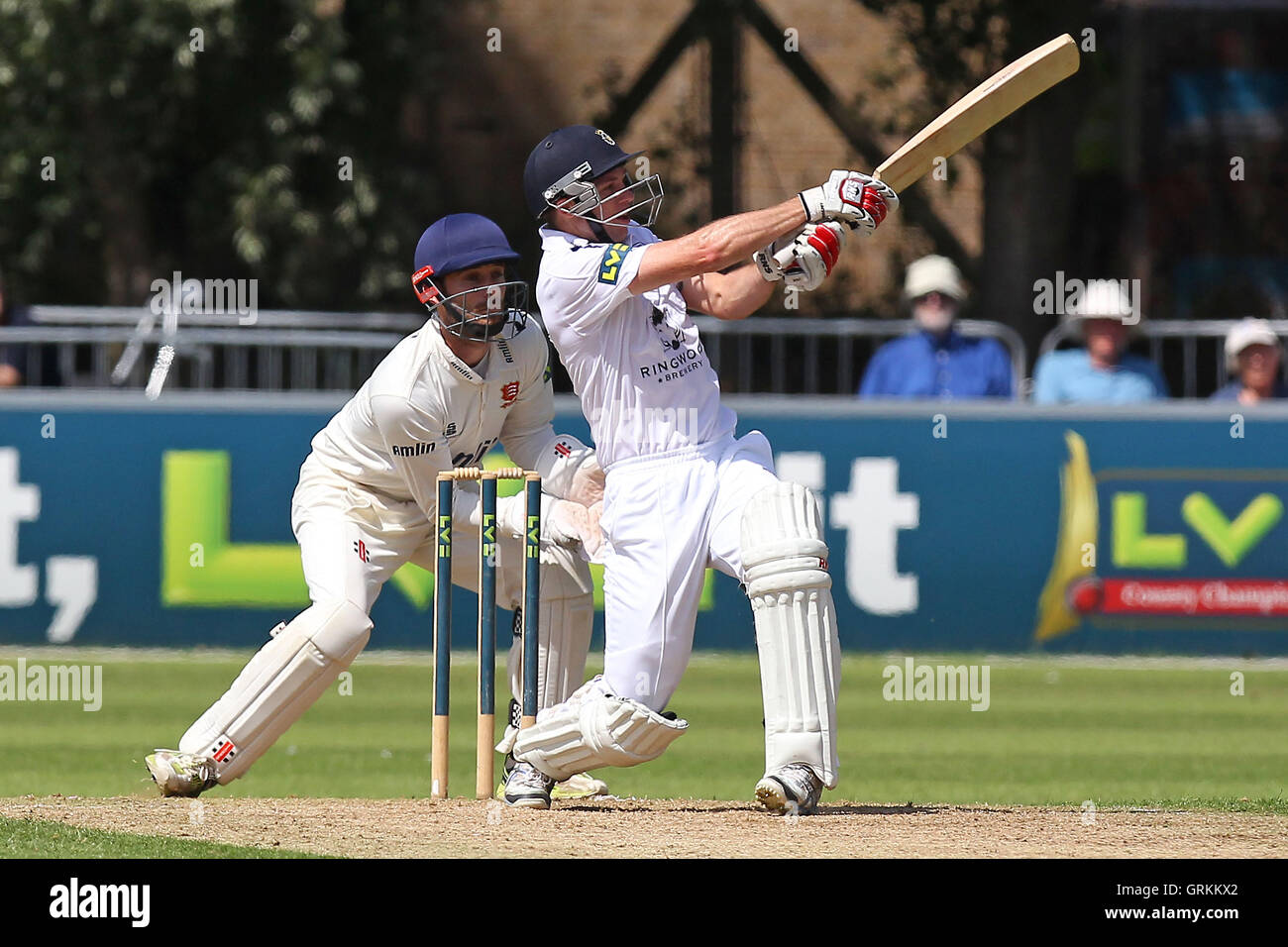 Nathan Rimmington of Hampshire hits out as James Foster looks on ...