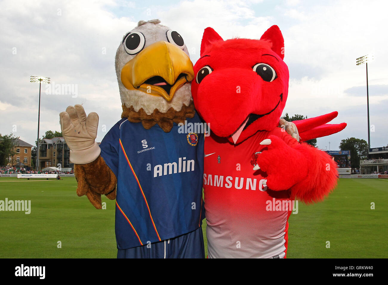 Eddie the Eagle (L) poses for a photo with Leyton Orient mascot Theo the Wyvern - Essex Eagles vs Sussex Sharks - NatWest T20 Blast Cricket at the Essex County Ground, Chelmsford, Essex - 25/07/14 Stock Photo