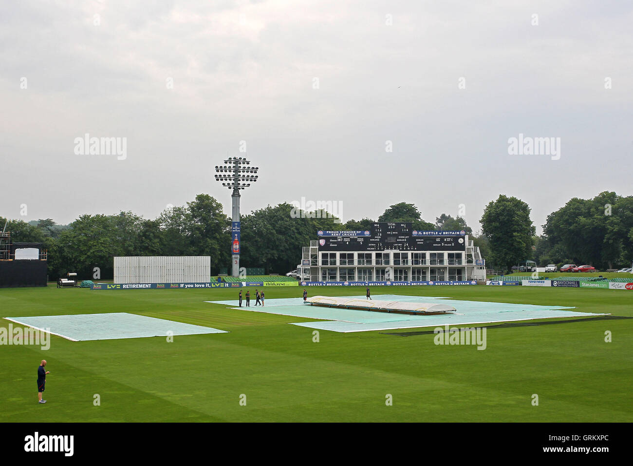 The covers are on the pitch as rain falls ahead of play on Day Three - Kent CCC vs Essex CCC - LV County Championship Division Two Cricket at the St Lawrence Ground, Canterbury - 09/06/14 Stock Photo