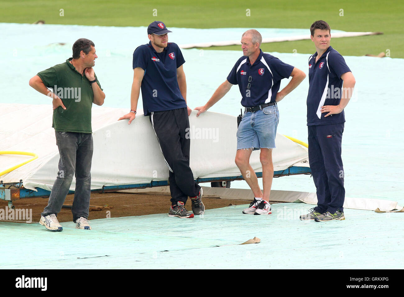 Ground staff keep a close eye on the weather as they stand by the covers - Kent CCC vs Essex CCC - LV County Championship Division Two Cricket at the St Lawrence Ground, Canterbury - 09/06/14 Stock Photo