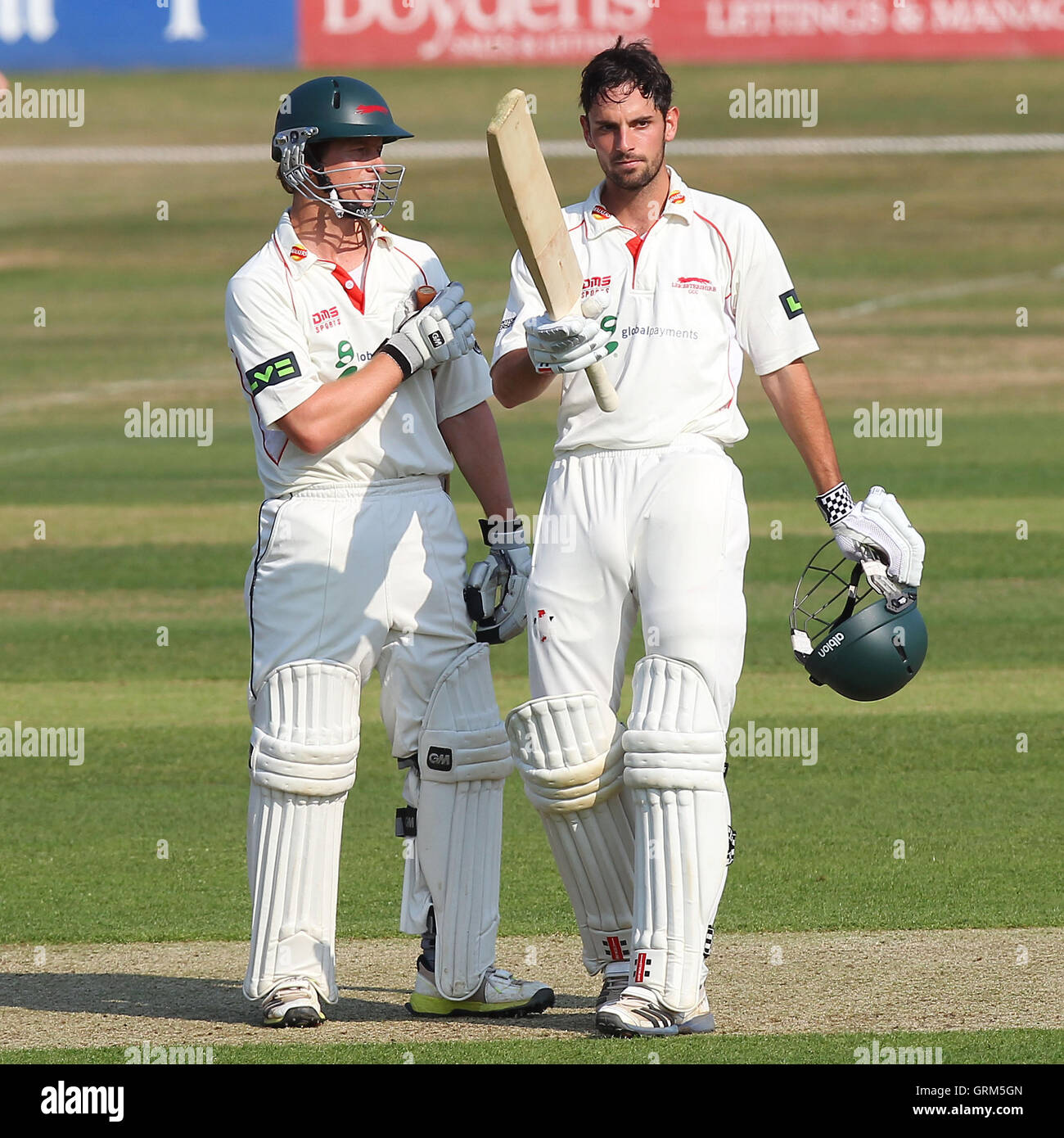 Ned Eckersley of Leicestershire celebrates a century, 100 runs for his team and is congratulated by captain Matthew Boyce (L) - Essex CCC vs Leicestershire CCC - LV County Championship Division Two Cricket at the Essex County Ground, Chelmsford - 17/07/13 Stock Photo