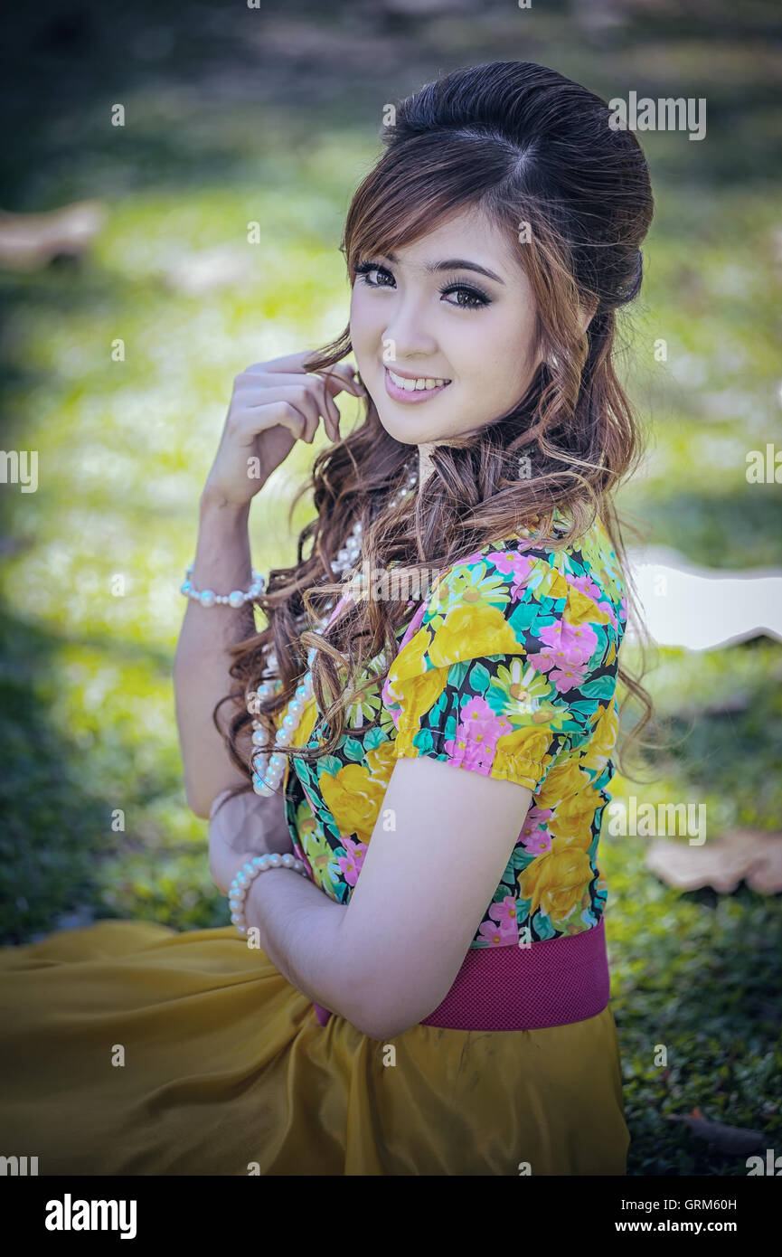 asia beautiful girl in the yellow dress on nature Stock Photo - Alamy