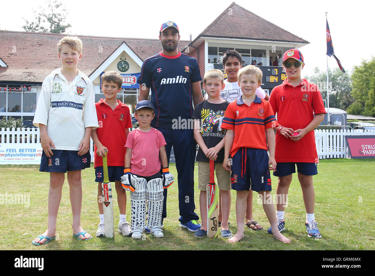 Ravi Bopara of Essex plays quick cricket with a group of youngsters and poses for a group photo - Essex CCC vs Northamptonshire CCC - LV County Championship Division Two Cricket at Castle Park, Colchester Cricket Club - 23/08/13 Stock Photo