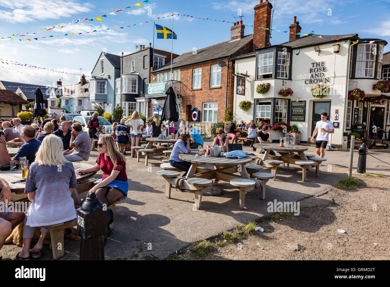The busy Rose and Crown on the waterfront at Wivenhoe, Essex, UK Stock