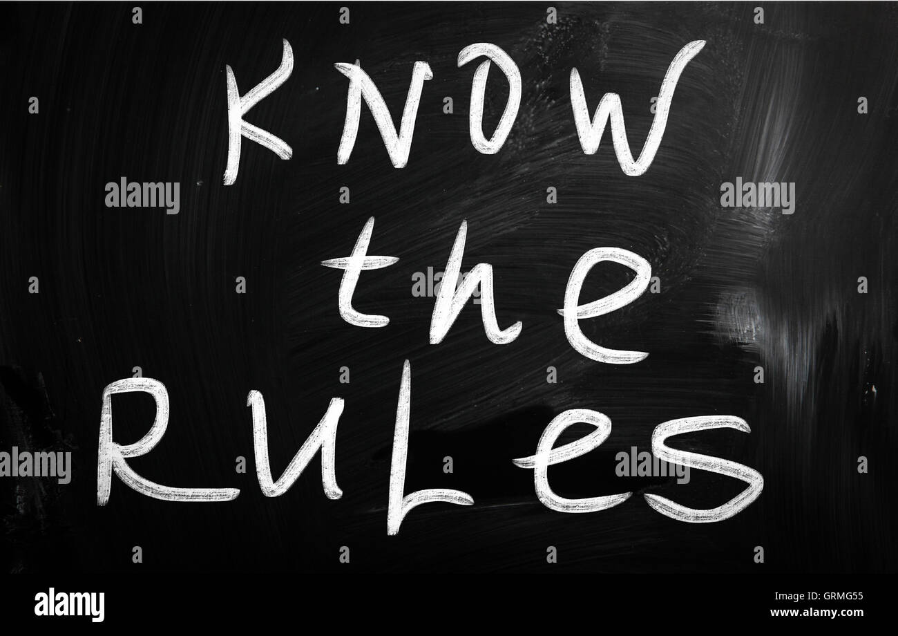 Know the rules handwritten with white chalk on a blackboard Stock Photo