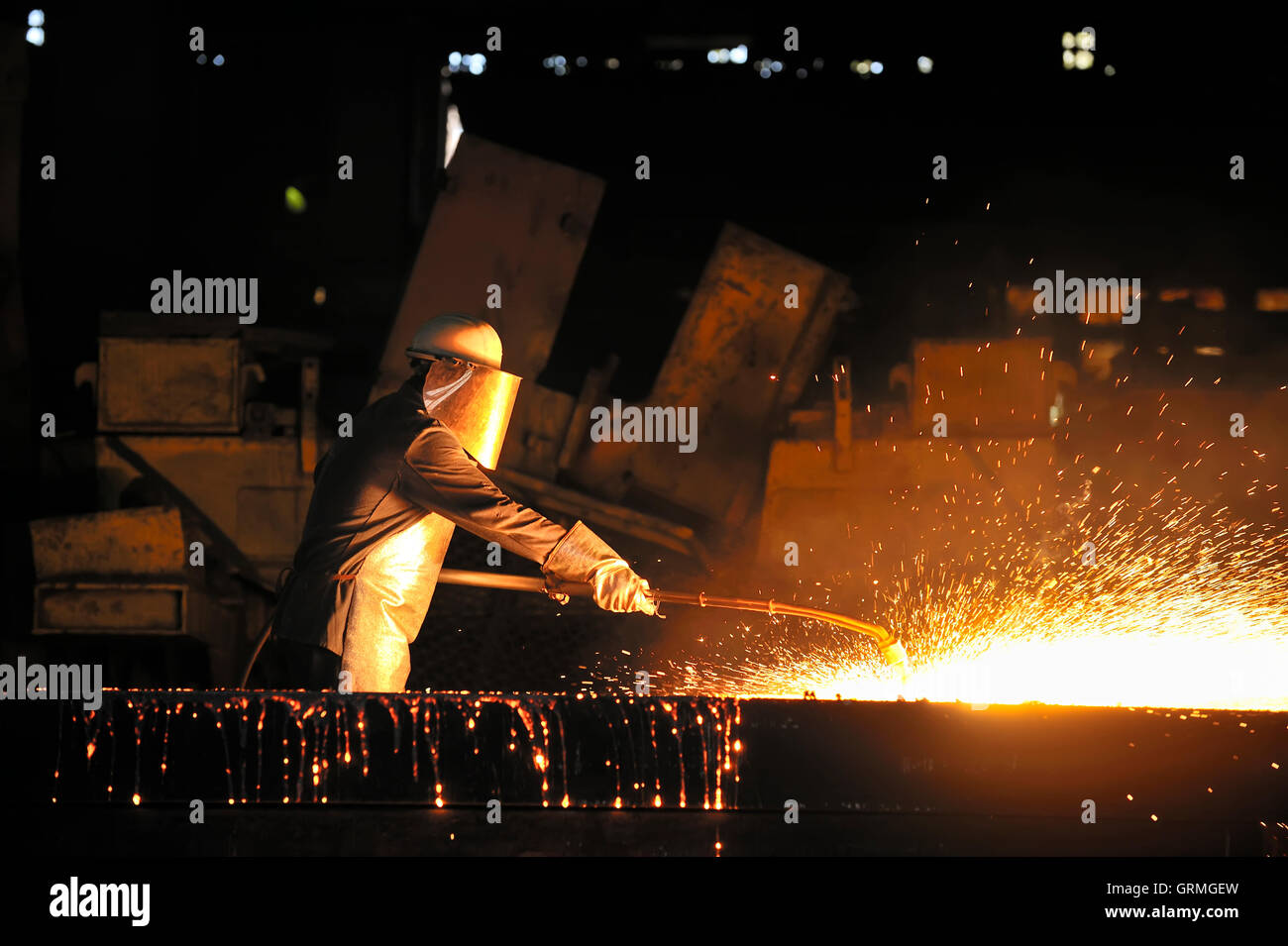 worker using torch cutter to cut through metal Stock Photo Alamy