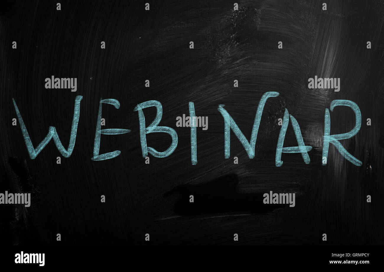 The word 'Webinar' handwritten with white chalk on a blackboard Stock Photo