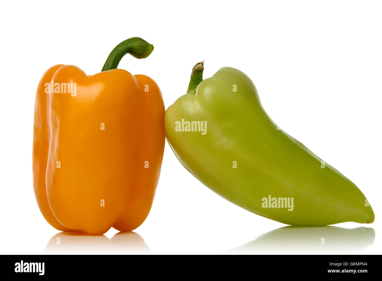 yellow and green peppers isolated over white background Stock Photo - Alamy