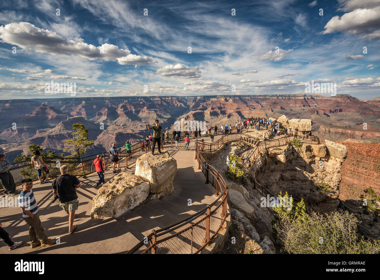 Tourists looking at south rim of Grand Canyon from point of view named 'Mather Point'. Stock Photo