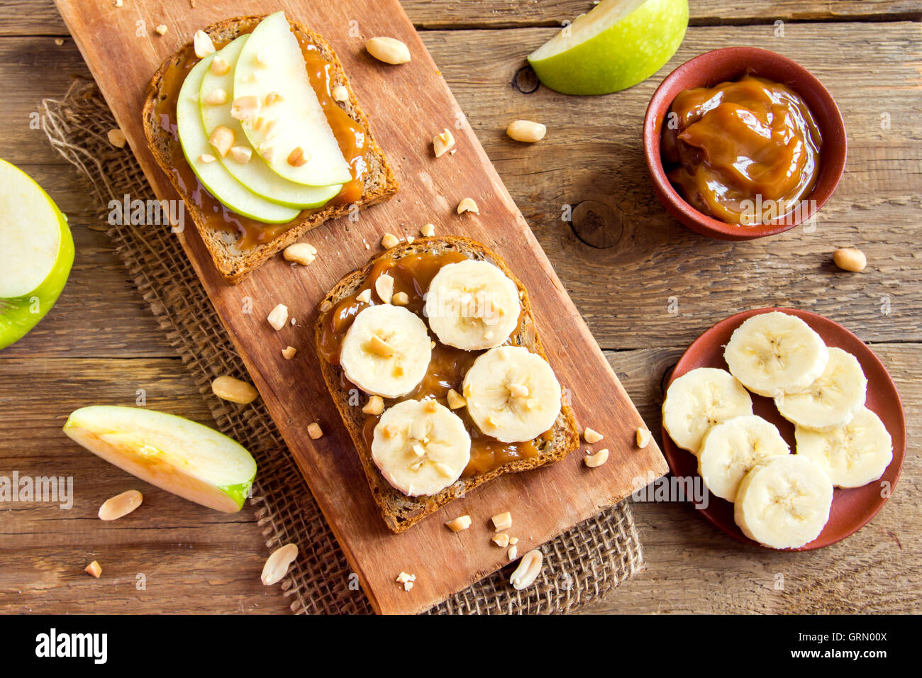 Peanut butter sandwiches with apple and banana for breakfast Stock