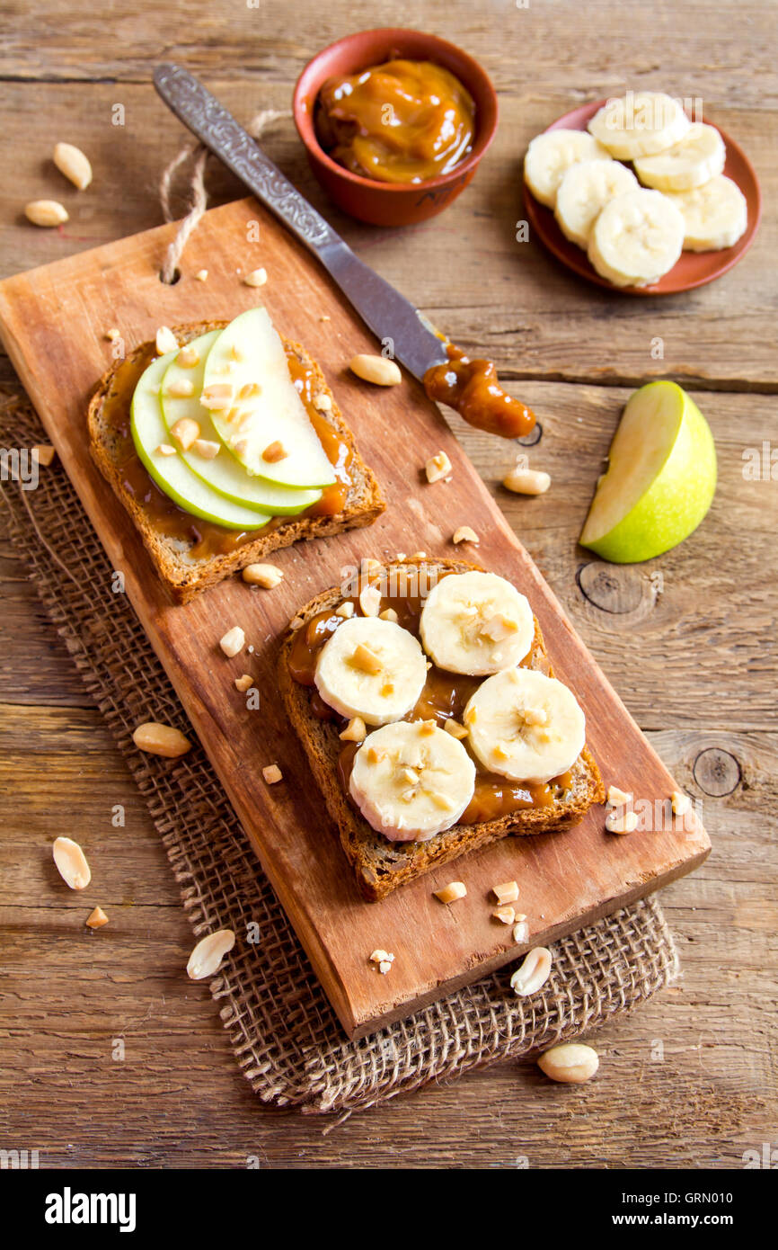 Peanut butter sandwiches with apple and banana for breakfast Stock