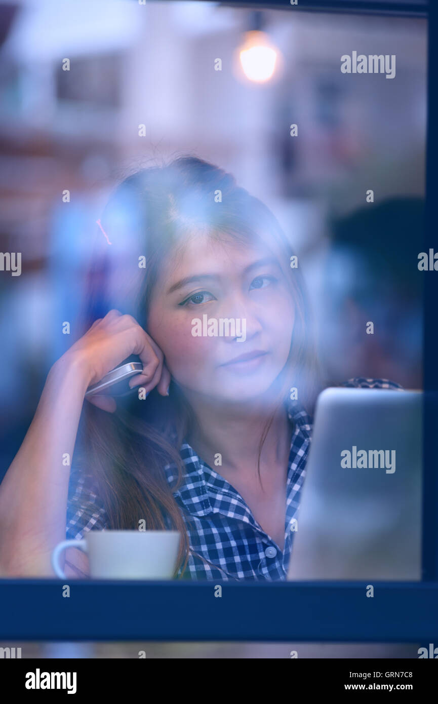 Portrait asia young woman working on laptop in coffee shop, Vacations ...