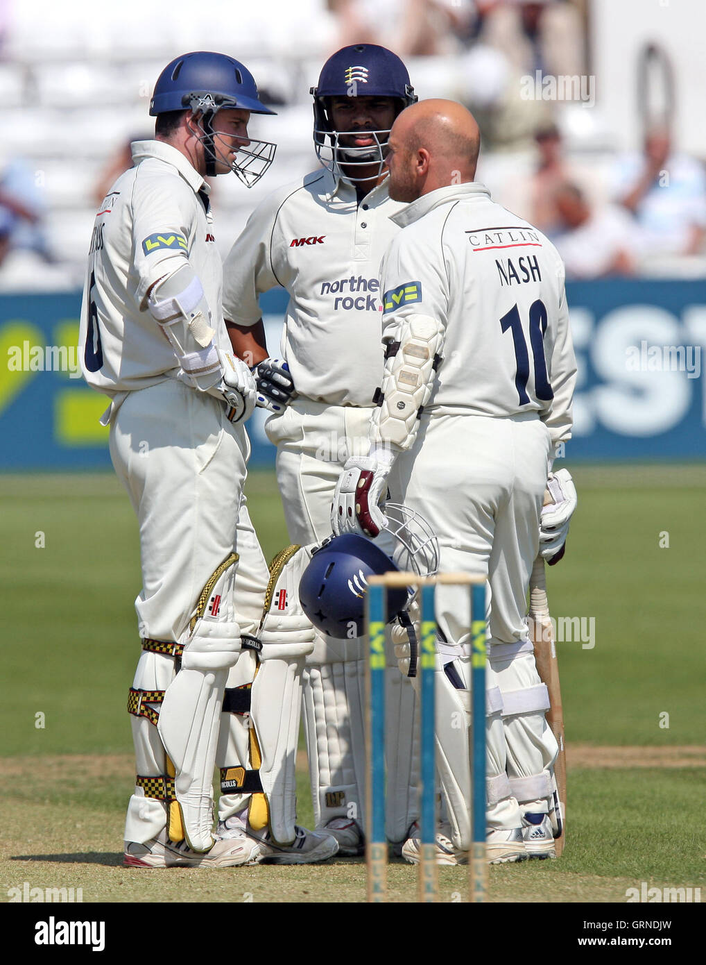 Three Middlesex batsman in the middle as Andrew Strauss (left) acts as