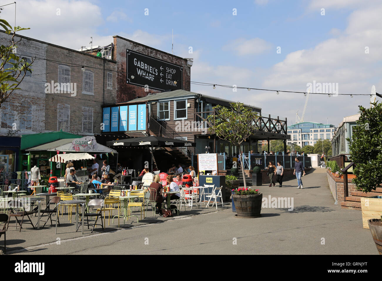 An open-air cafe at Gabriel's Wharf on London's South Bank. An area of small shops and restaurants by the River Thames Stock Photo