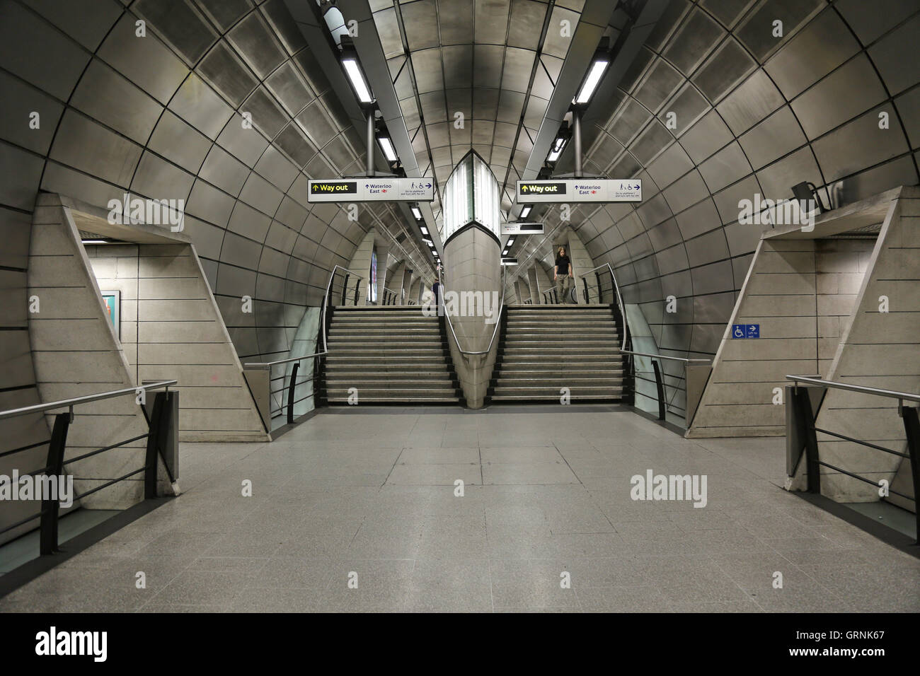 Central passenger access tunnel at Southwark Underground Station on London's Jubilee Line. Designed by MJP Architects Stock Photo