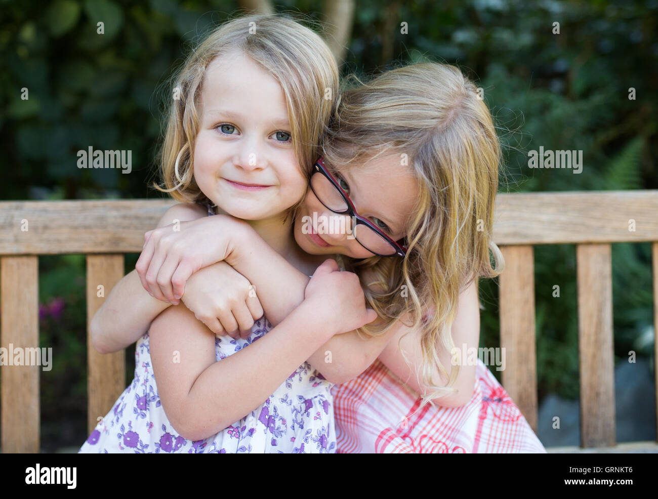 sisters cuddling and happy Stock Photo