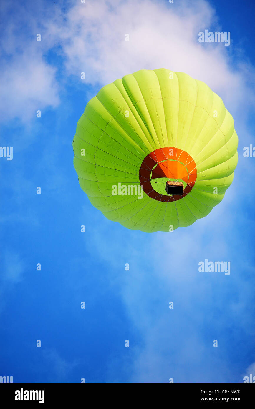 Green balloon in clouds Stock Photo - Alamy