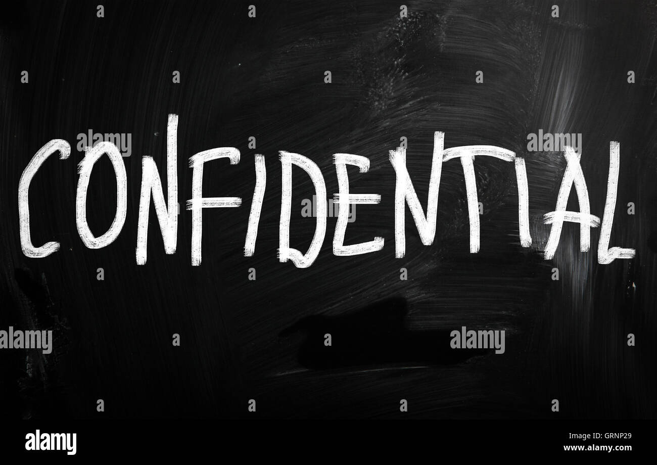 Confidential handwritten with white chalk on a blackboard Stock Photo