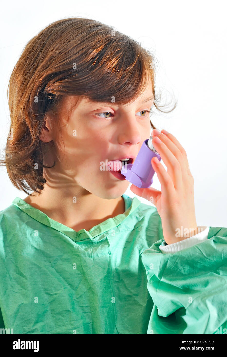 little girl using inhaler Stock Photo