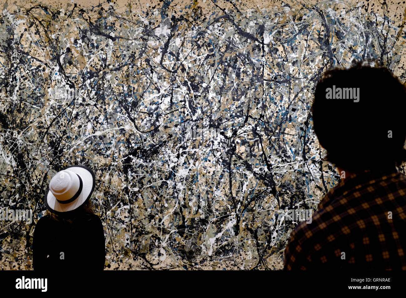 Visitors in front of 'Number 31' painting by Jackson Pollock in Museum of Modern Art (MoMA).Manhattan,New York City,USA Stock Photo