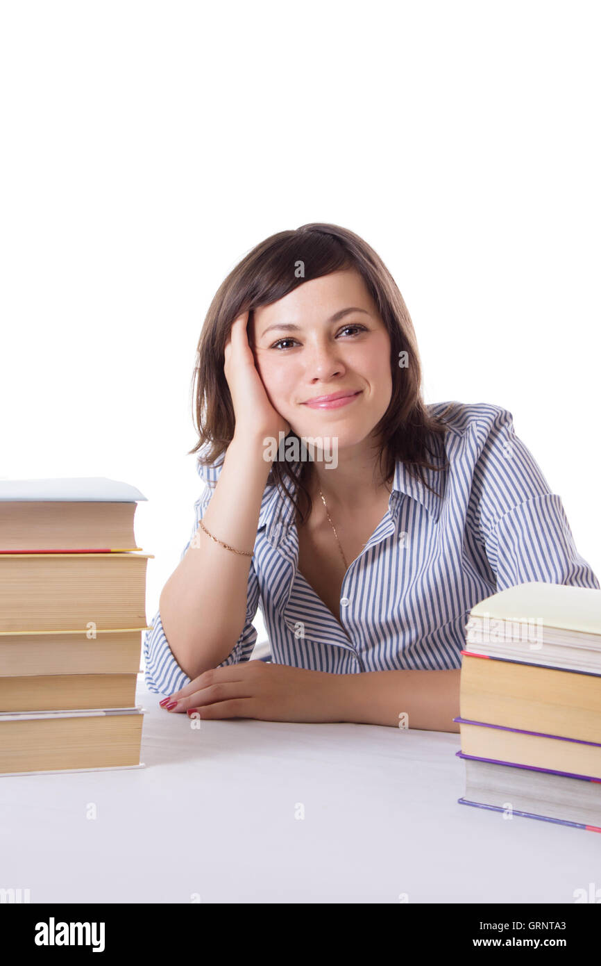 Student girl sitting with pile of books Stock Photo - Alamy