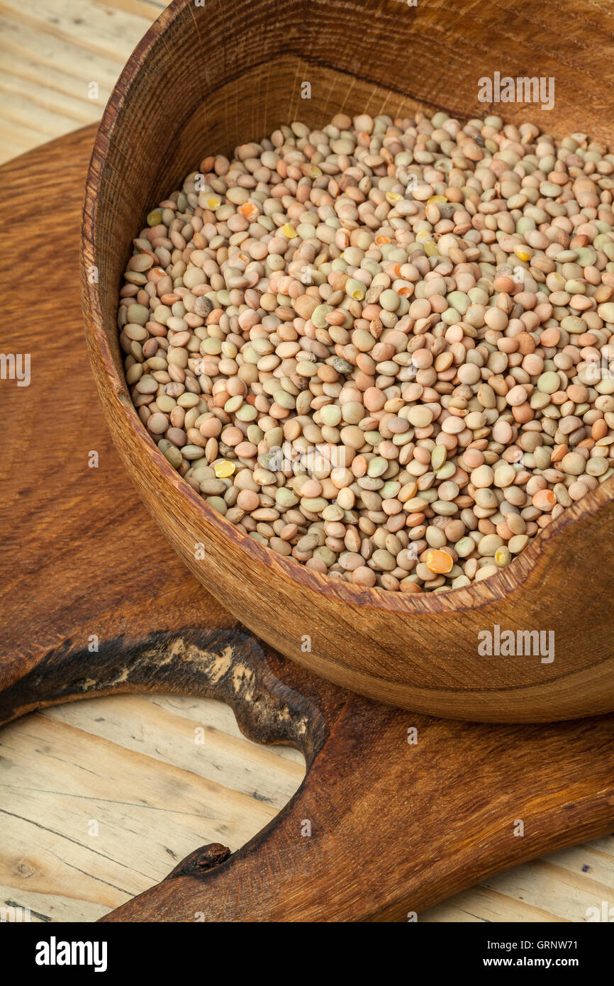 Image of lentils in a wooden bowl. Stock Photo