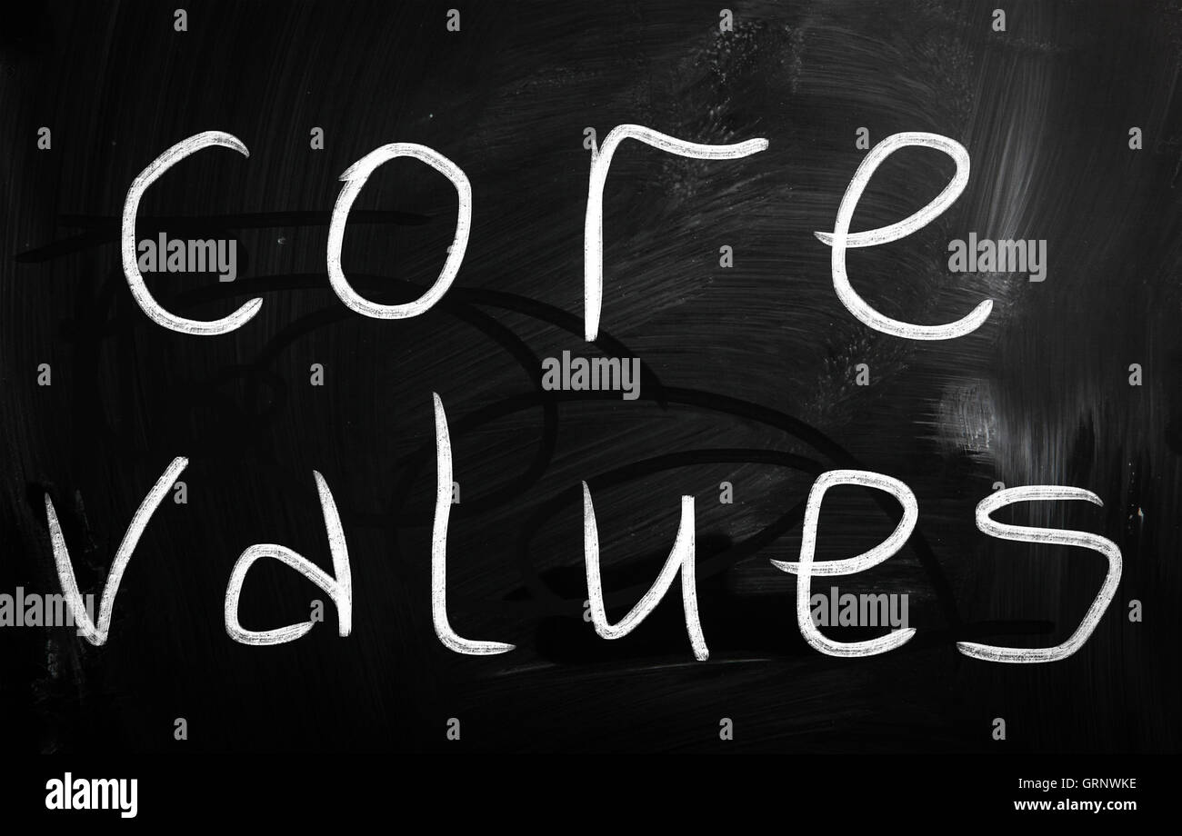core values handwritten with white chalk on a blackboard Stock Photo
