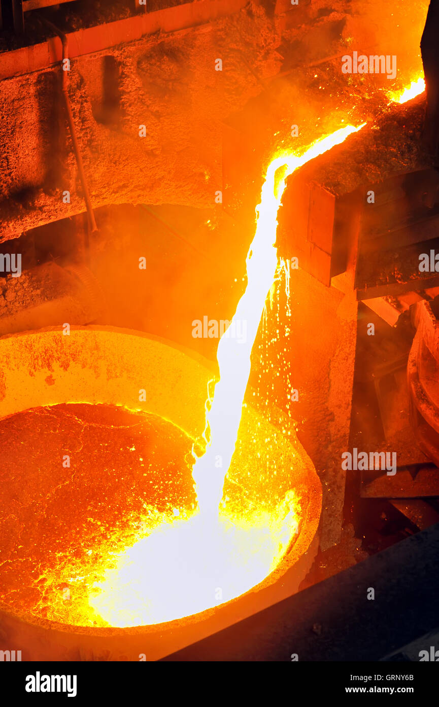 Pouring of liquid metal Stock Photo Alamy