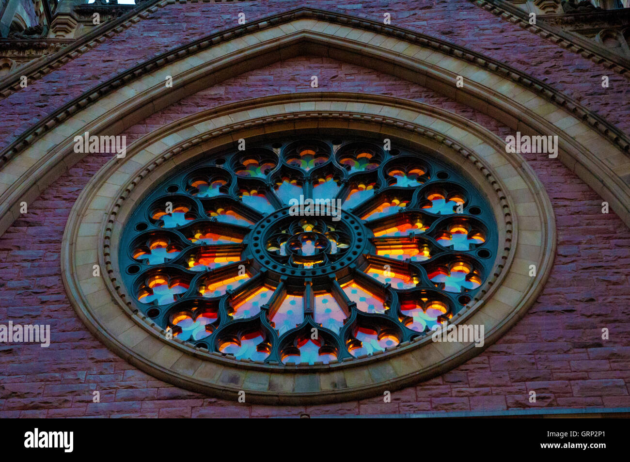 Close-Up Detail of Front Featured Facade Round Window Illuminated on Saint James United Church, Montreal, Quebec, Canada Stock Photo