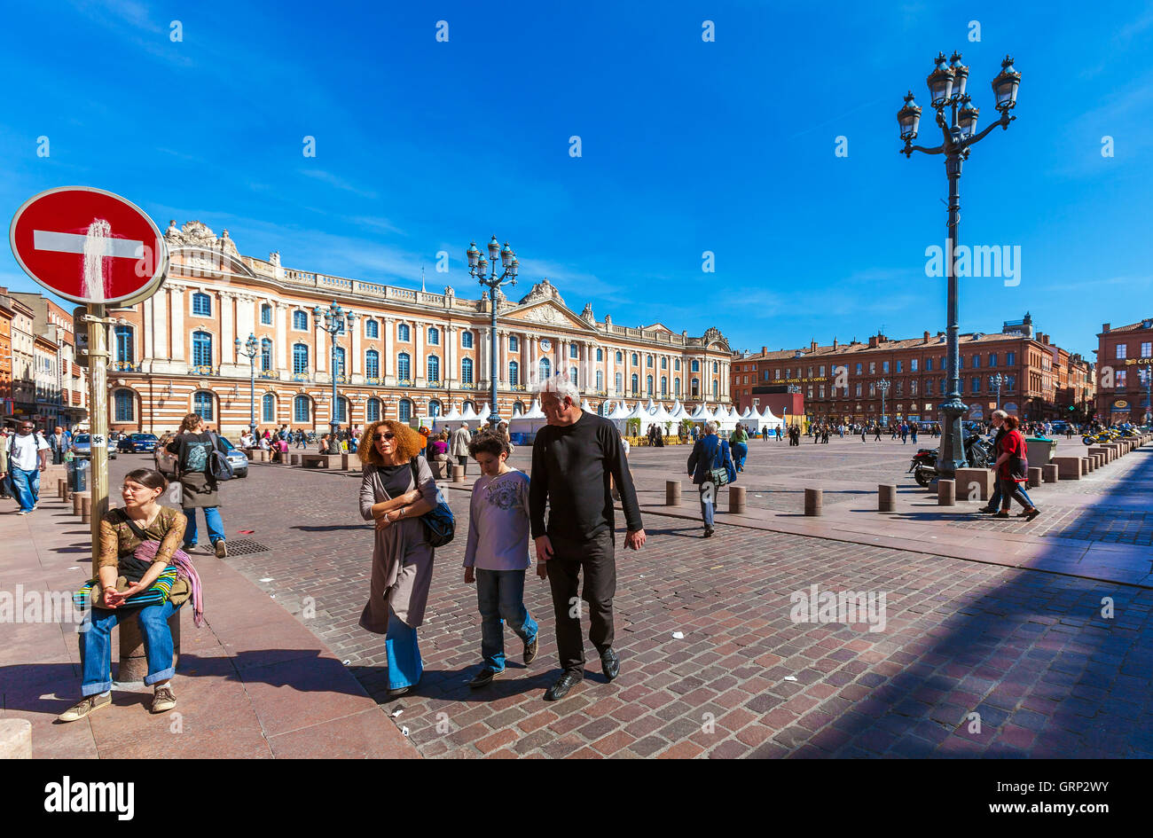 TOULOUSE, FRANCE - APRIL 1, 2011: French people walking at city center near magistrate Stock Photo