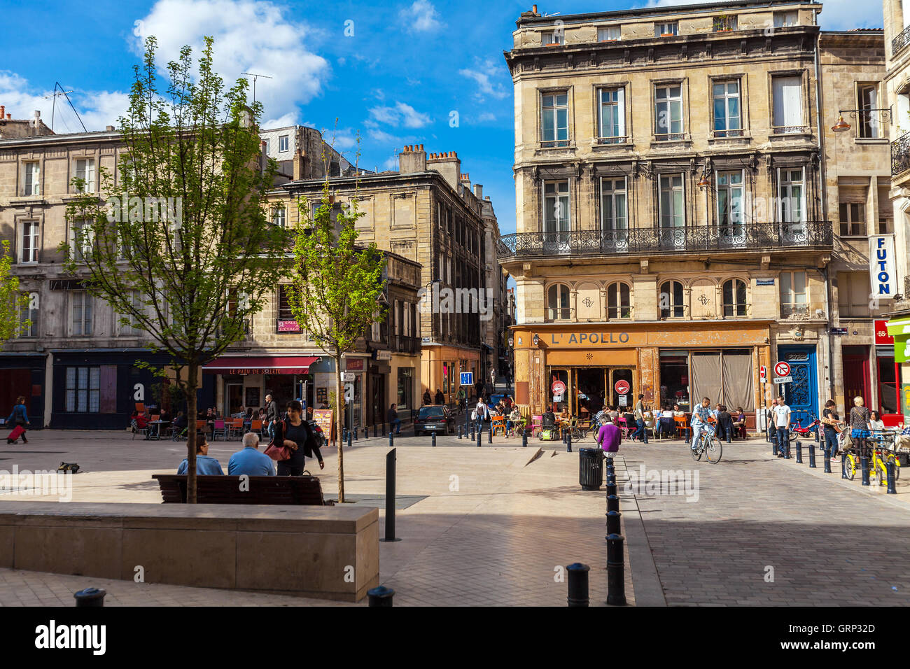BORDEAUX, FRANCE - APRIL 4, 2011: French people walking at streets of old city with ancient homes Stock Photo