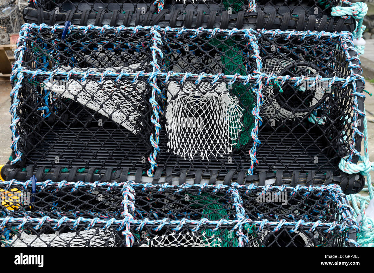 Lobster pots on the quayside at Seahouses harbour in Northumberland, England. Stock Photo