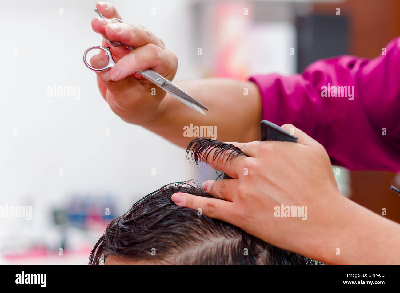 Man hair cutting, stylist needs a comb and scissors for this