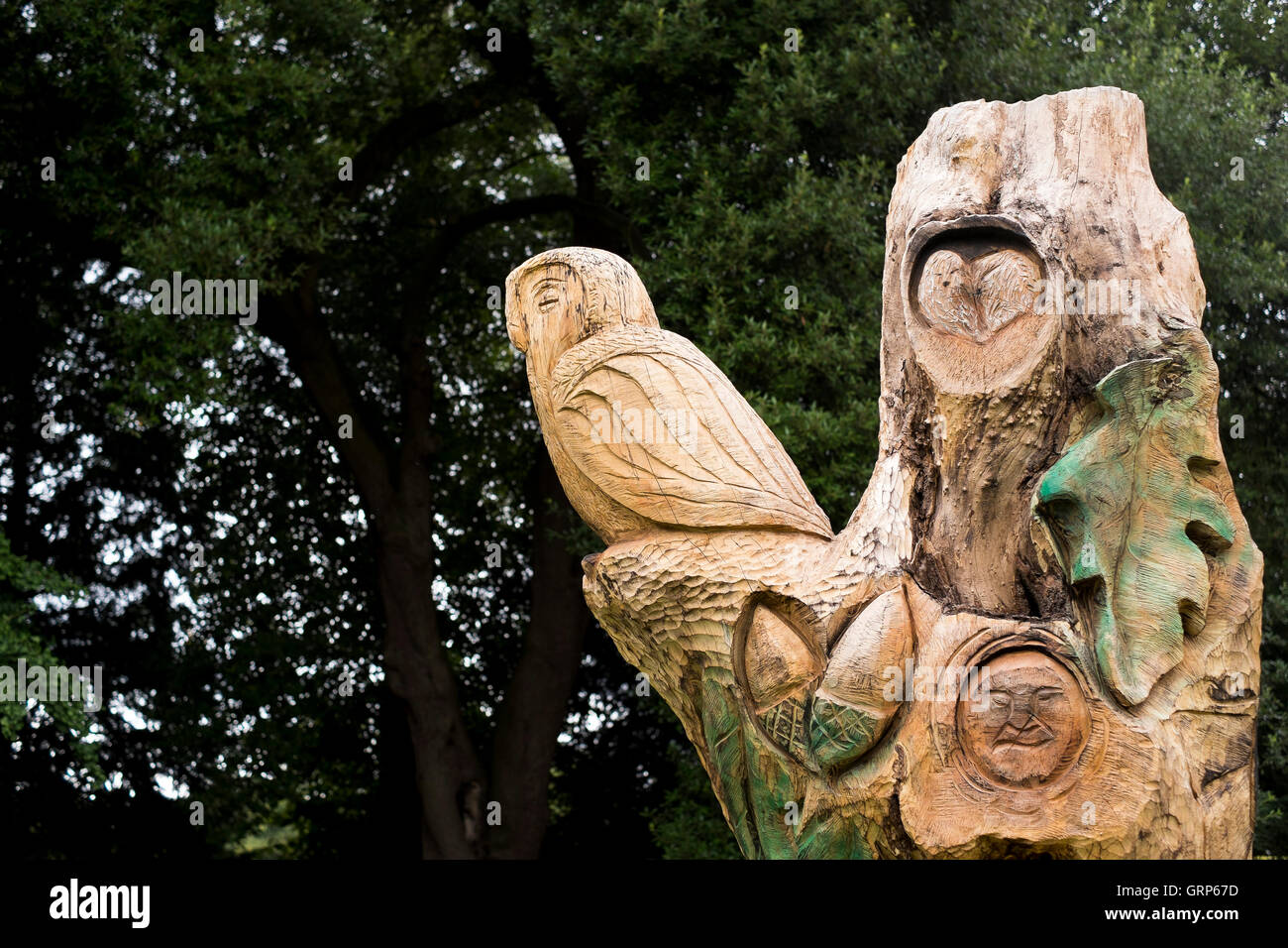 A wood carving created from a dead tree in the grounds of Castle Ashby House, Northamptonshire Stock Photo