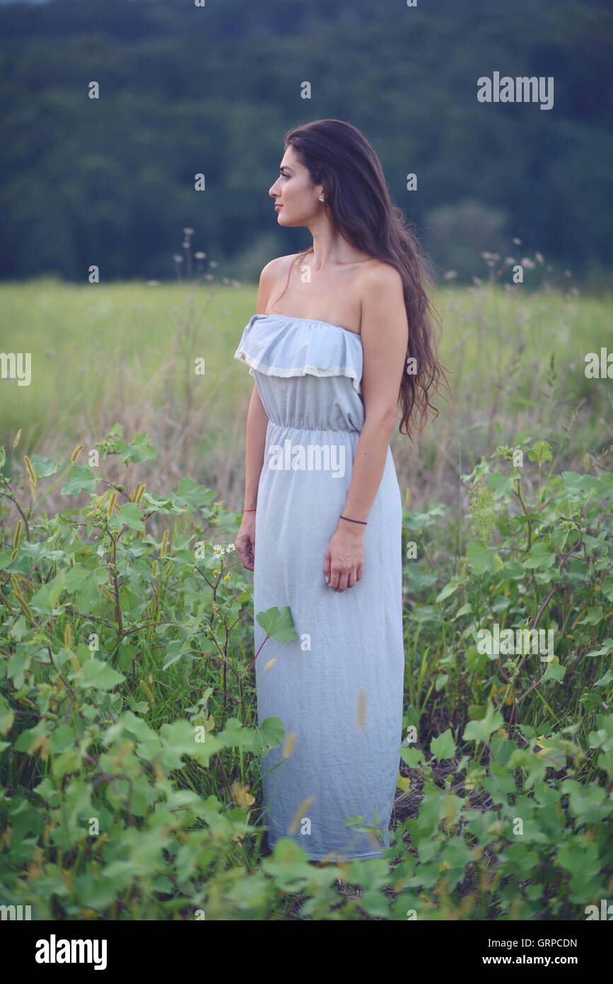 Girl enjoying nature on the field on a beautiful summer day Stock Photo ...