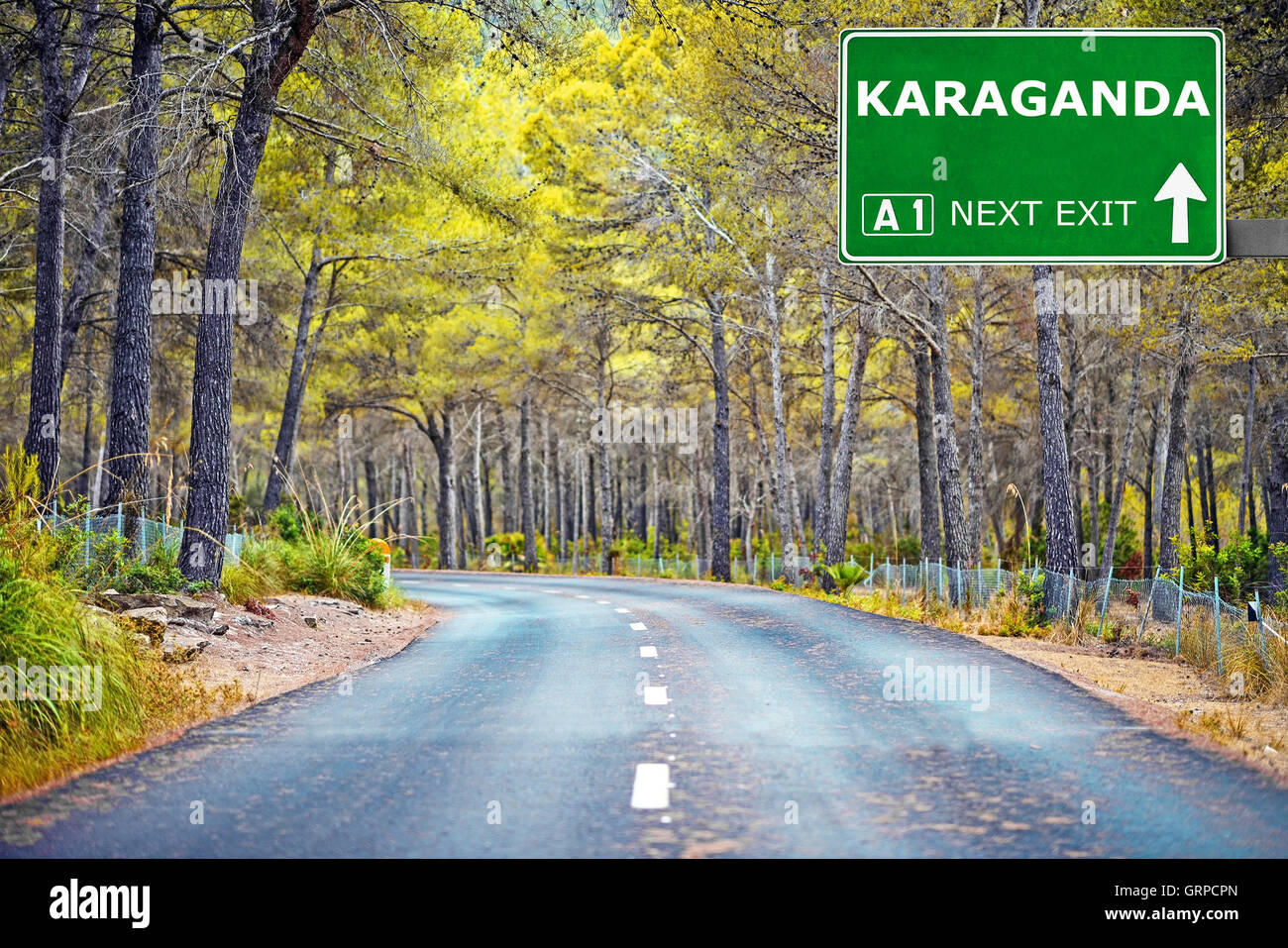 KARAGANDA road sign against clear blue sky Stock Photo
