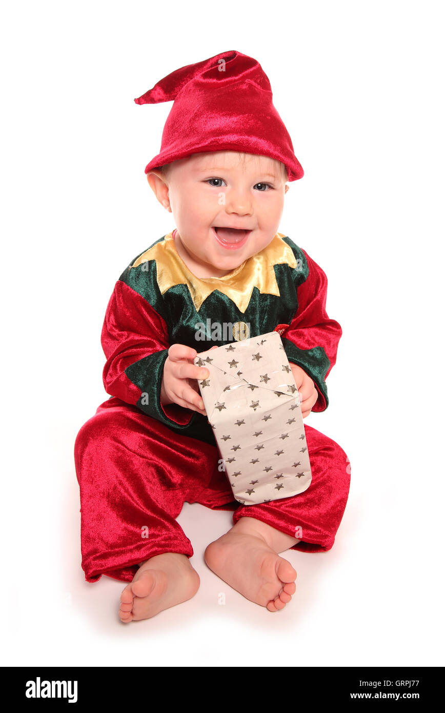 infant dressed in elfs santas little helper fancy dress costume cutout Stock Photo
