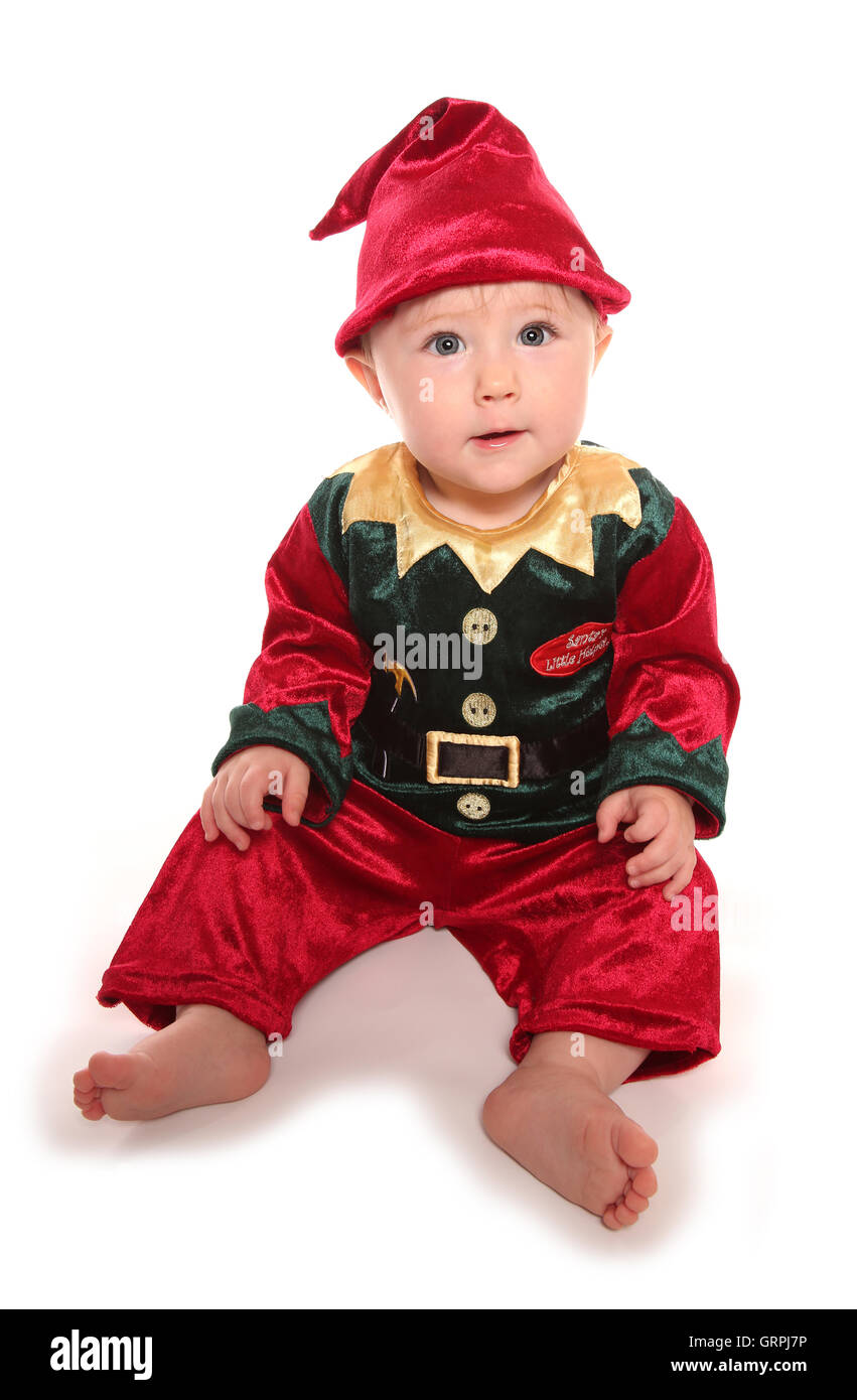 infant dressed in elfs santas little helper fancy dress costume cutout Stock Photo
