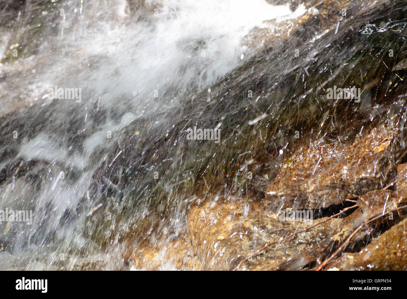 Splashing Water on Rocks Stock Photo - Alamy
