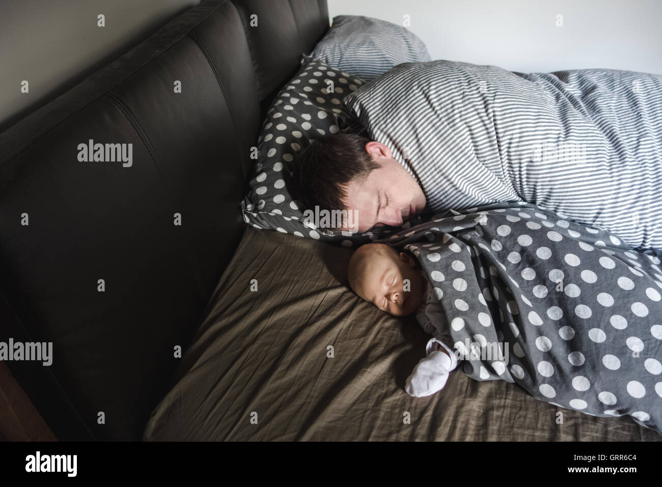 Newborn Baby boy sleep with his father Stock Photo Alamy
