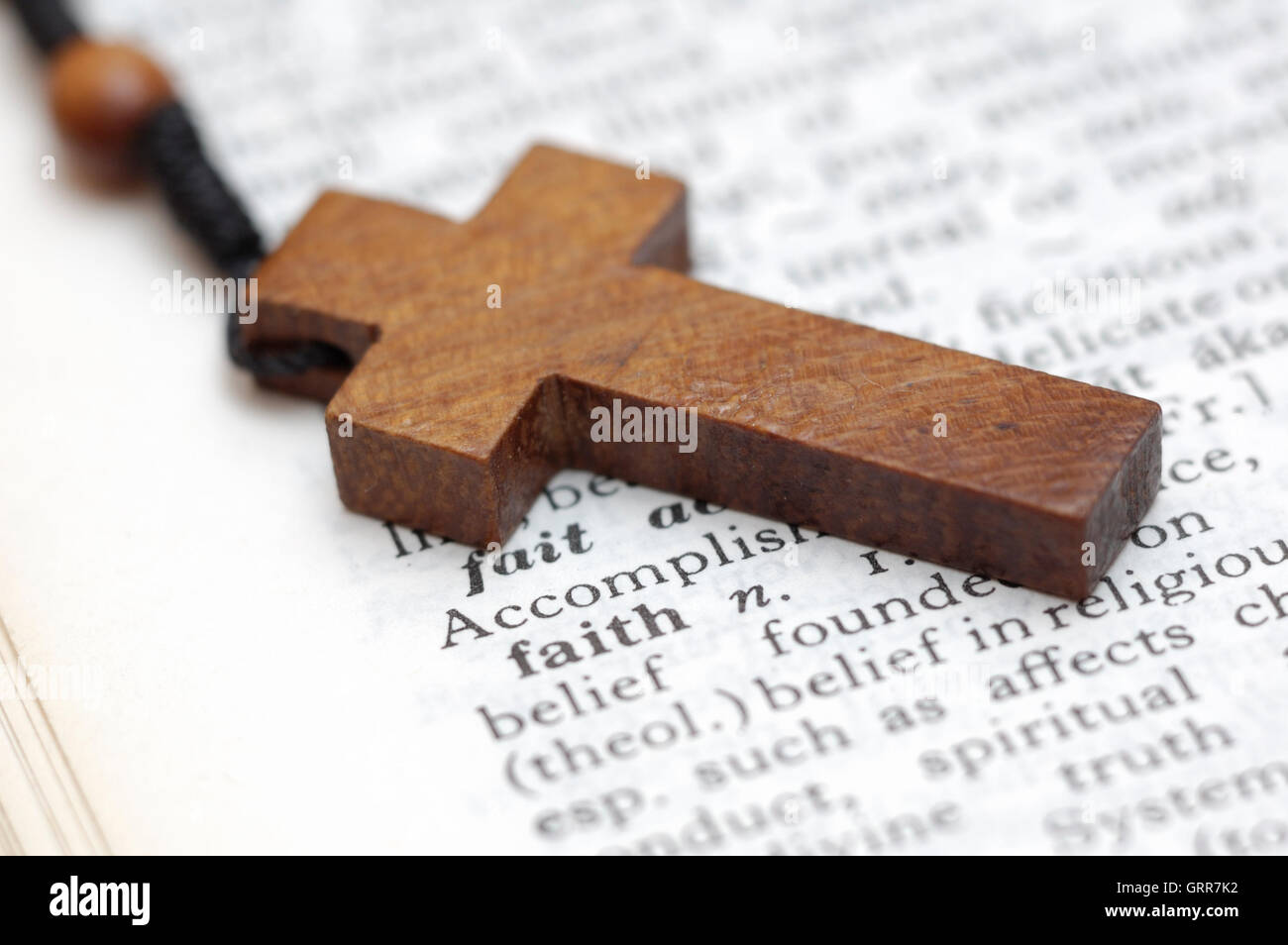 Cross on dictionary Stock Photo Alamy