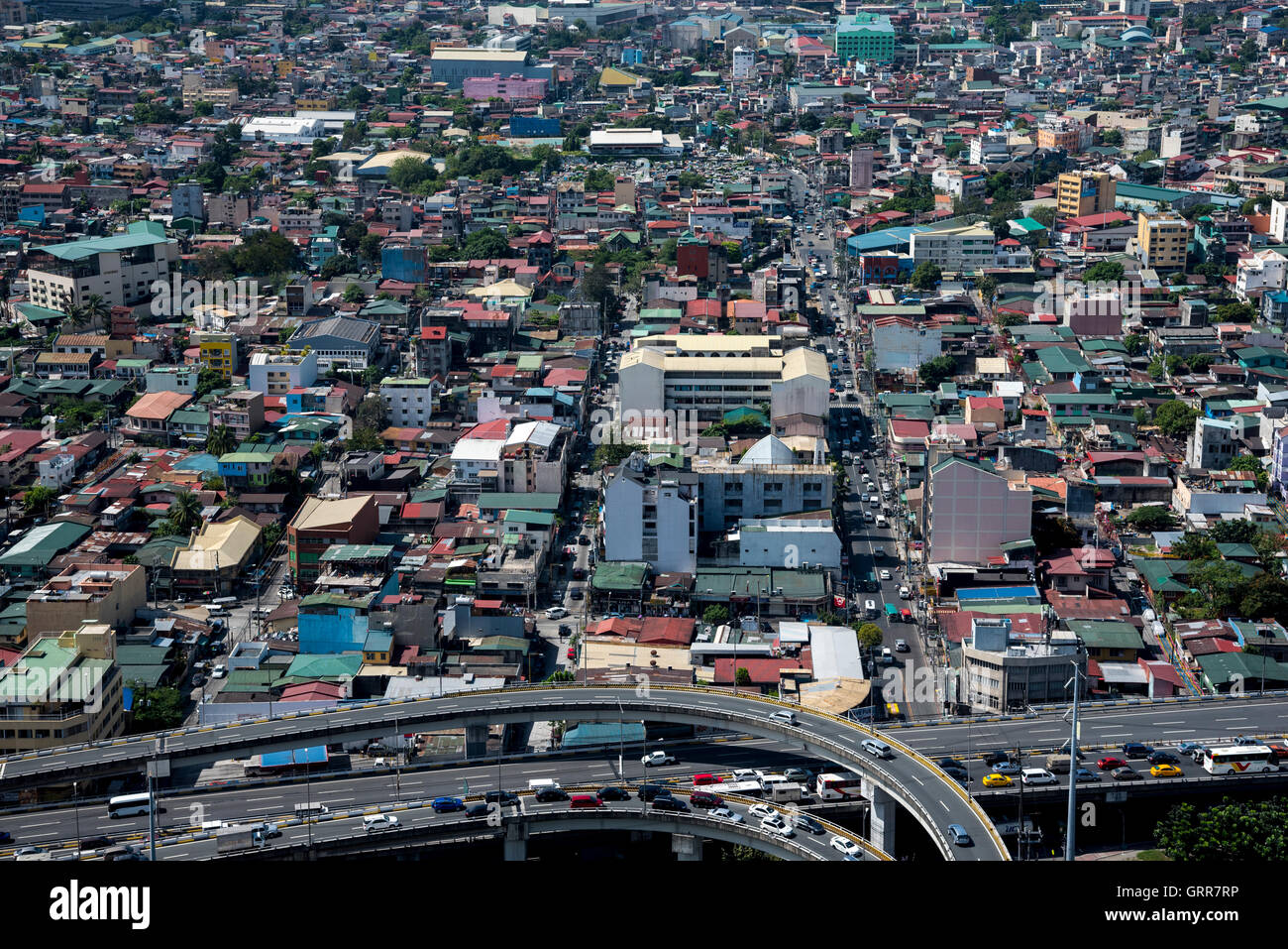 The Metro Manila Skyway in the foreground and various houses and buildings in the background, Manila, Philippines. Stock Photo