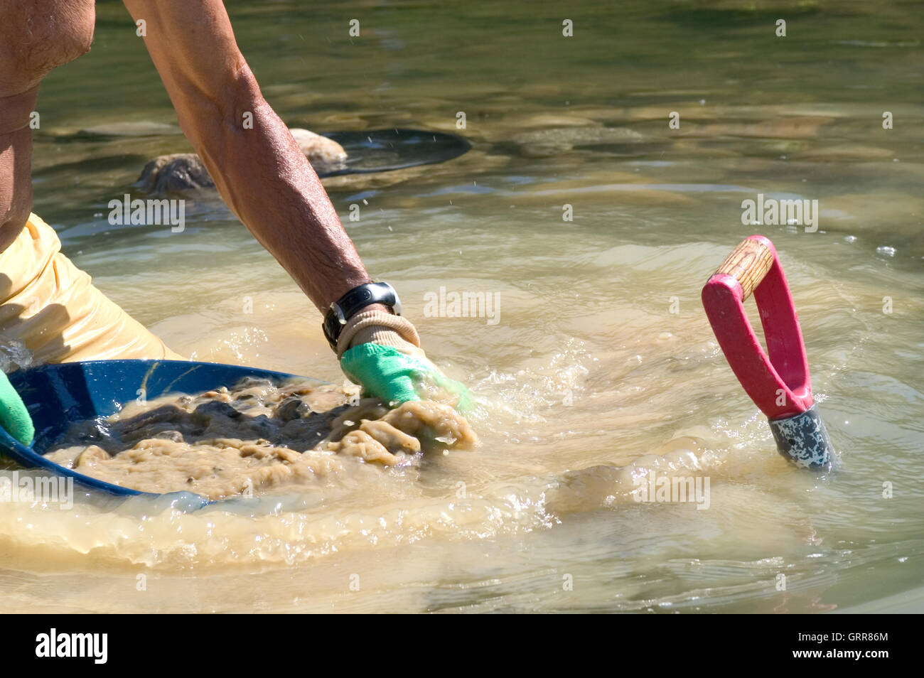 close up on the work of a gold digger in the river Gardon in the French department of Gard Stock