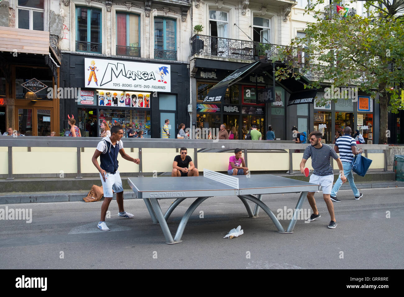 two people playing table tennis street brussels Stock Photo