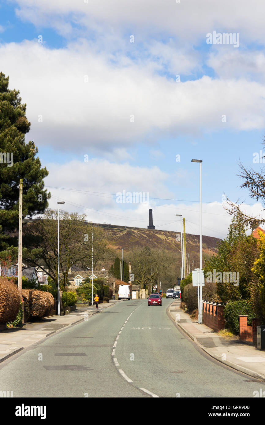 The B6215 Holcombe Road, Greenmount, Bury, Lancashire, looking towards the Peel Monument tower on Holcombe Moor. Stock Photo