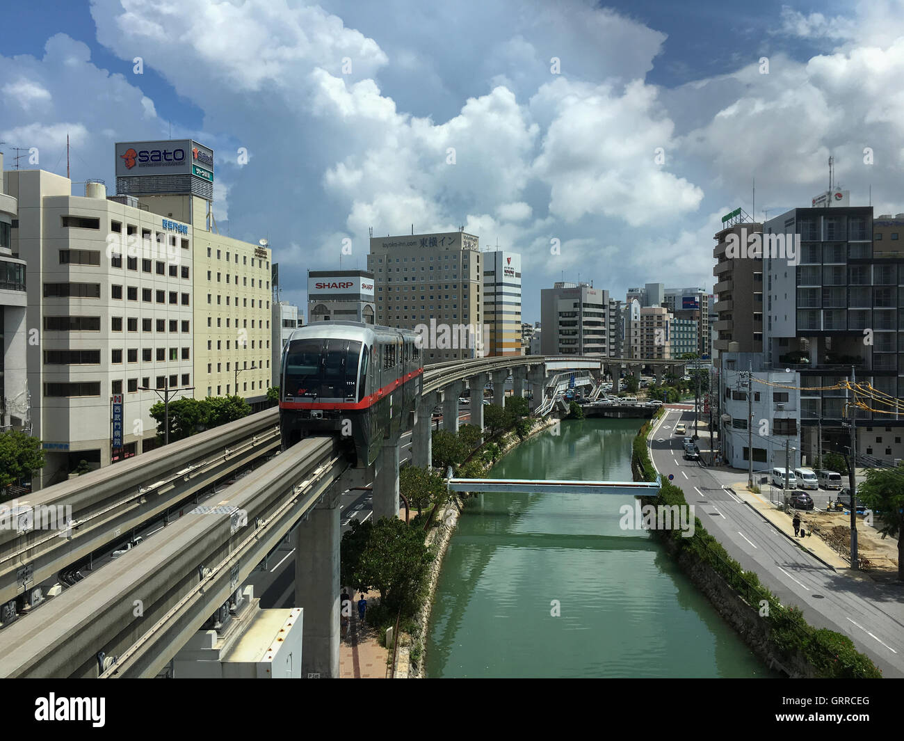 Okinawa Monorail, Yui-Rail is an only rail transport in Naha, Okinawa, Japan. It's approaching Asahibashi station in the morning Stock Photo