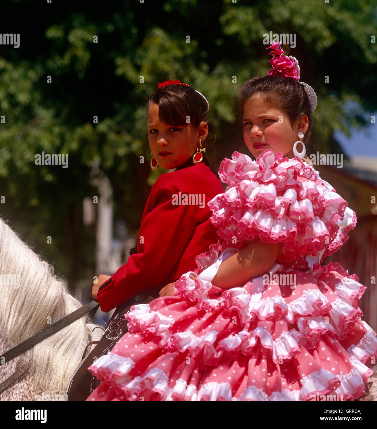 Spanish girls in National dress at the Feria (Horse Fair) in Seville, Andalucia, Spain Stock Photo