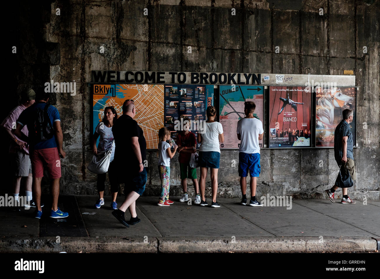 'Welcome to Brooklyn'. A sign under the Brooklyn Bridge after leaving the walkway from Manhatten Island Stock Photo